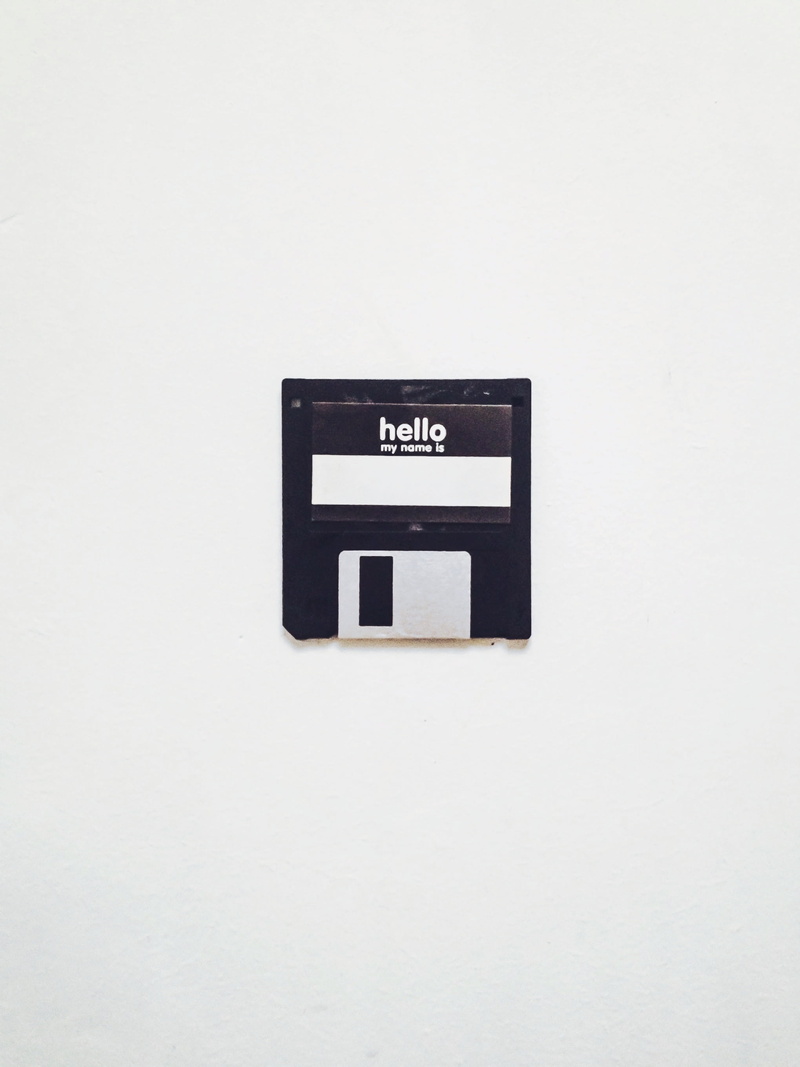 wall - building feature, letter, retro, black color, communication, power supply, white background, floppy disk, 2K, electricity, no people, sign, white color