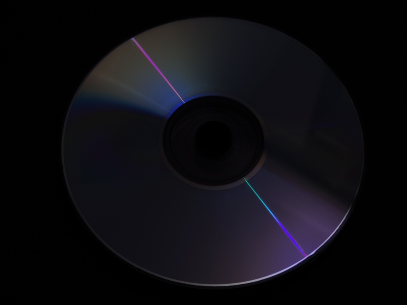 no people, nature, dark, outdoors, arts culture and entertainment, 2K, dvd, optical instrument, floppy disk, purple, shape, spinning, computer, black background