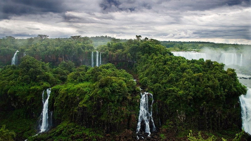 green color, sky, day, outdoors, standing, beauty in nature, nature, tree, forest, trees, cloud - sky, scenics - nature, growth, waterfall, tropical forest