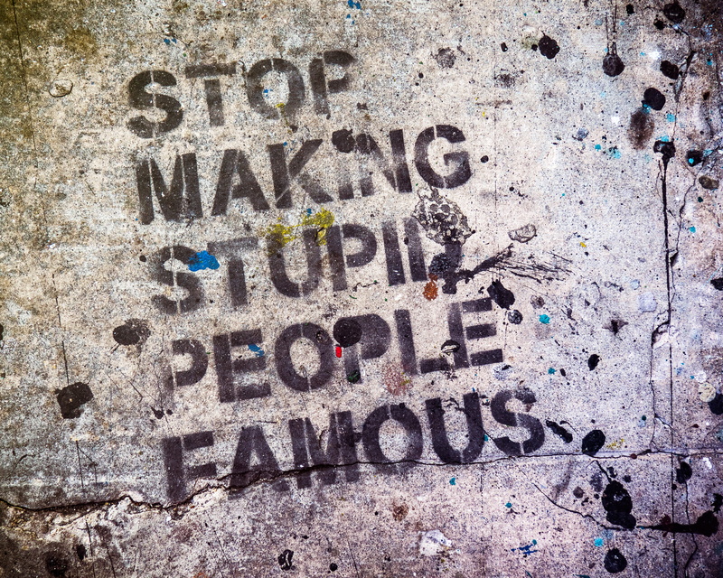 writing, information, stupid, graffiti, text, printed, day, street, backgrounds, wall, capital letter, built structure, people, message, concrete, paint