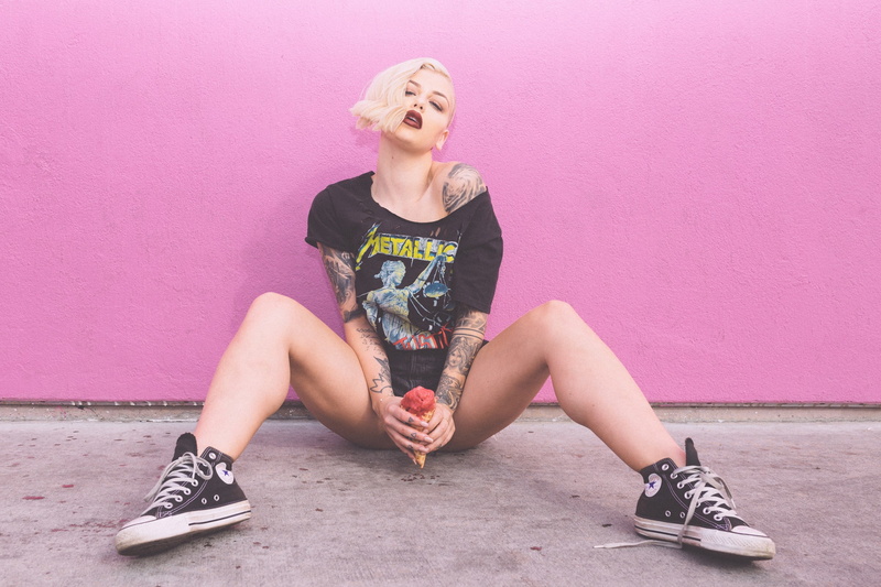 hairstyle, full length, sitting, shirt, childhood, 1080P, suggestive, real people, pink color, leisure activity, shoe, young adult, casual clothing, s