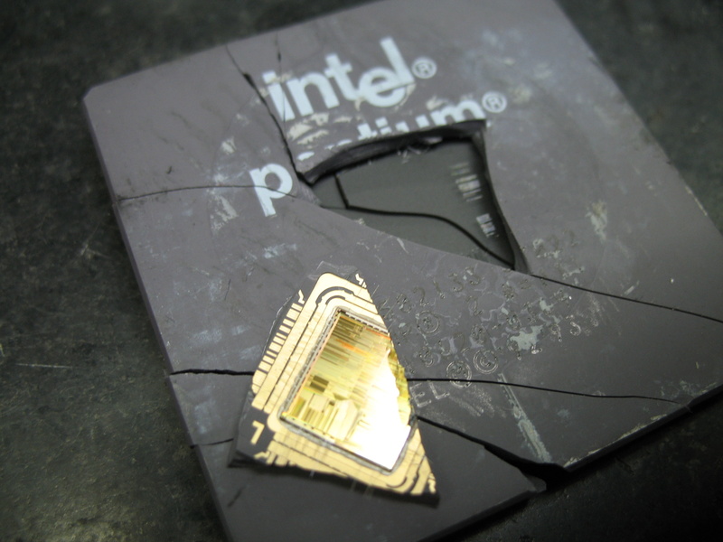 still life, capital letter, indoors, technology, Intel, day, computer, communication, ingot, high angle view, damaged, wet, finance, number, yellow, metal