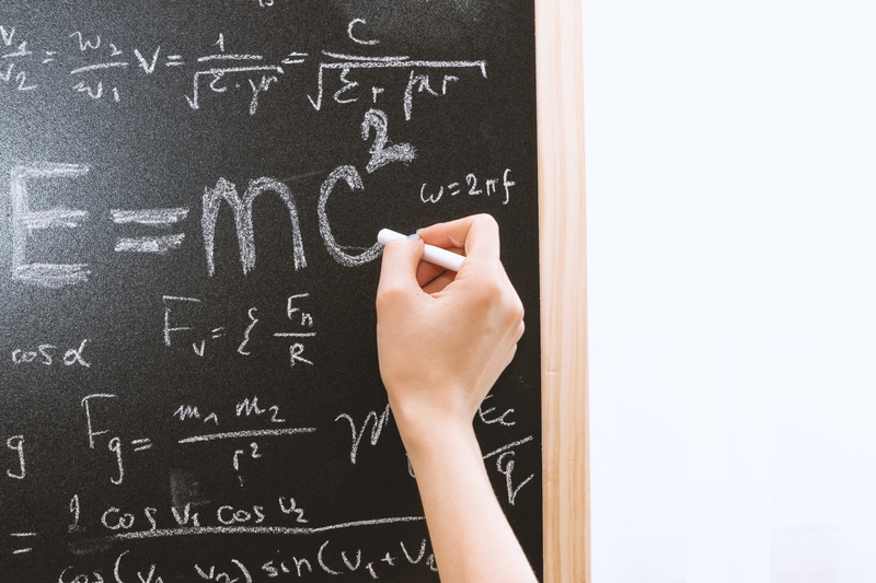 chalk, concept, blackboard, people, front, writing, human body part, hand, board, number, classroom, female, intelligence, school, einstein, solution, mathematics