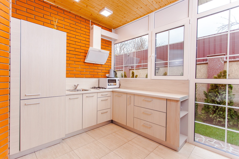 tiled floor, cabinets, home interior, domestic room, home showcase interior, room, tile, wood - material, domestic kitchen, indoors, contemporary, brick wall
