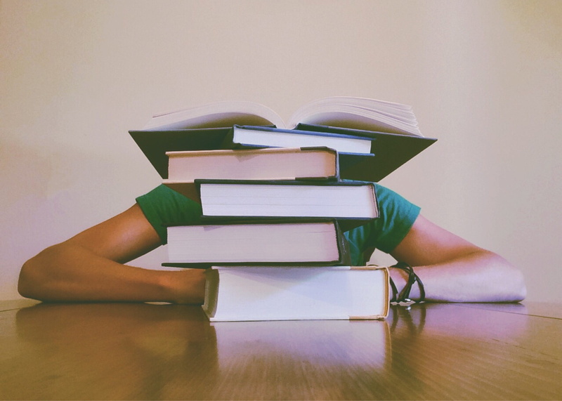 desk, adult, reading, college, read, learning, holding, literature, stress, wooden table, learn, focus, research, university, knowledge, obscured face