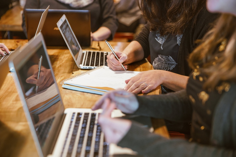 business, students, workshop, using laptop, women, brainstorming, two people, over the shoulder view, Coding, photo, teamwork, table, creativity, young women