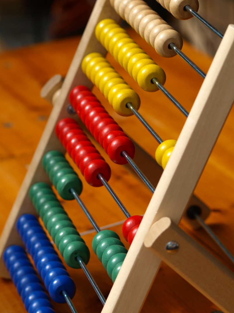 table, multicolored, slide rule, in a row, indoors, music, education, school, wood - material, learning, high angle view, multi colored, math, 2K, calculating