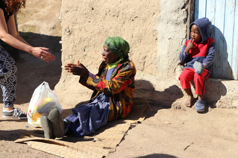 Poverty, charity, daytime, sitting, Villager, males, lifestyles, near, talking, boys, ask for alms, mature adult, wall, leisure activity, full length, Alms