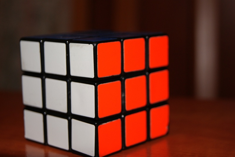 leisure games, relaxation, table, no people, solved, 4K, single object, rubik, shape, strategy, indoors, puzzle, wood - material, 3d, flooring, still life