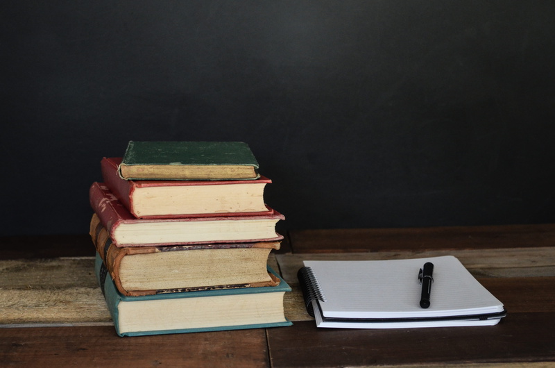 pen, paper, white, group of objects, still life, beside, notebook, black, indoors, studying, table, no people, studio shot, black background, copy space
