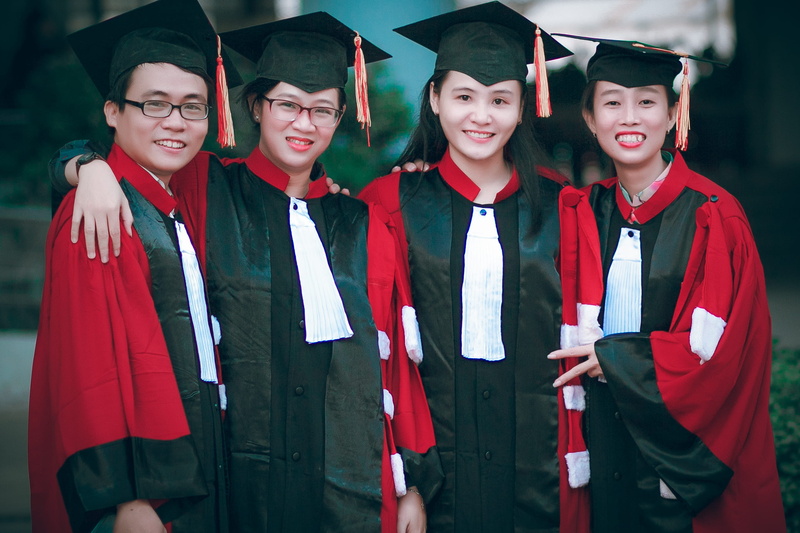 education, diploma, university, waist up, togetherness, celebration, gown, portrait, group of people, cap, graduates, gowns, teenager, graduation gown