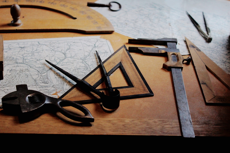 man made object, hand saw, wood - material, hand tool, high angle view, old, indoors, rulers, scissors, 5K, art and craft, tool, craft, black, metal, table