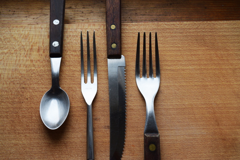 food, metal, restaurant, utensils, variation, order, table knife, lunch, brown, dinner, lay, work tool, tools, cafe, meal, utensil, arrangement, indoors