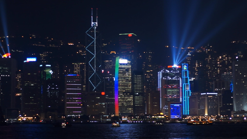 field, scoreboard, training, outdoors, skyscraper, background, cityscape, landmark, illuminated, waterfront, glowing, water, event, no people, match, business district