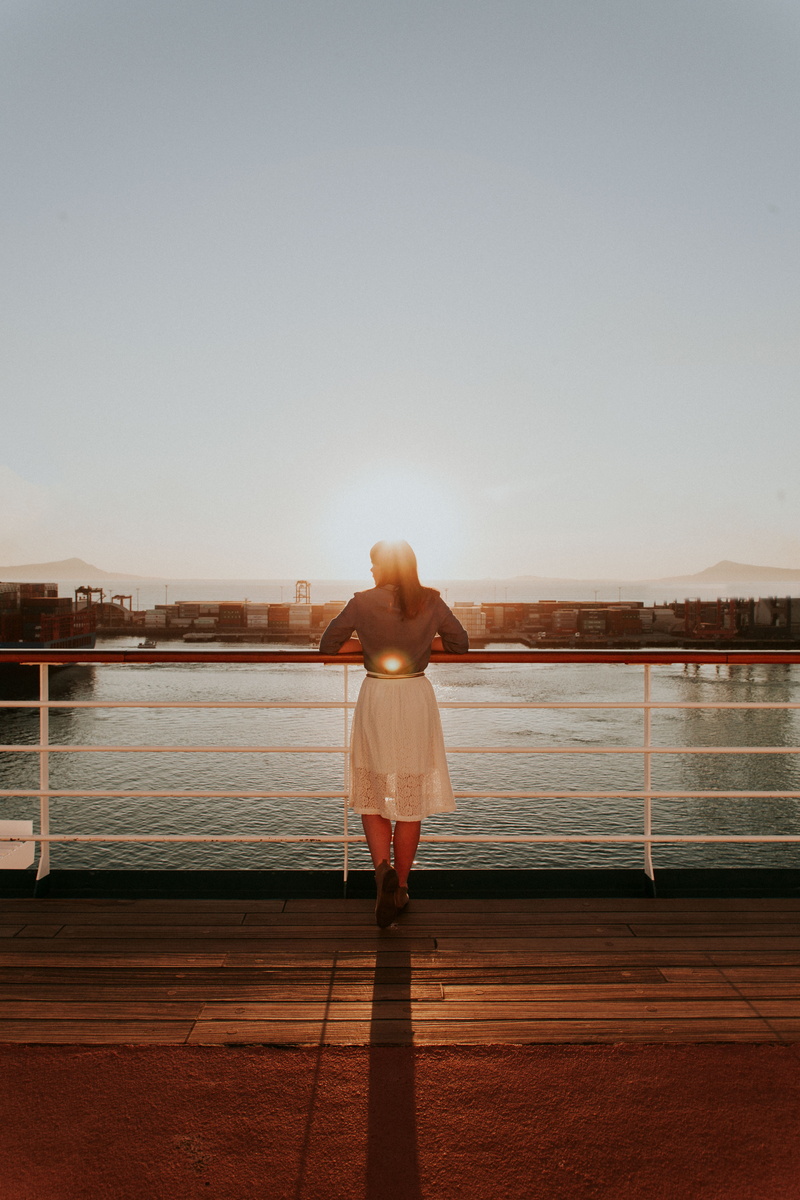 casual clothing, sea, real people, leisure activity, ocean, woman, body, sunset, full length, built structure, near, looking at view, daytime, nature, looking
