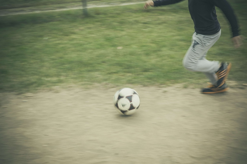 lifestyles, soccer ball, ball, kid, ambition, len, fit, leisure activity, motion, action, body part, full, competitive, grass, adolescent, playing, blurred motion