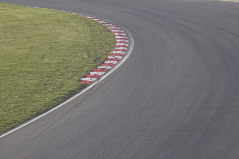 circuit, competitive sport, grass, championship, empty, green color, racetrack, outdoors, sport, racing, fast, sports track, auto, day, curve, track and field