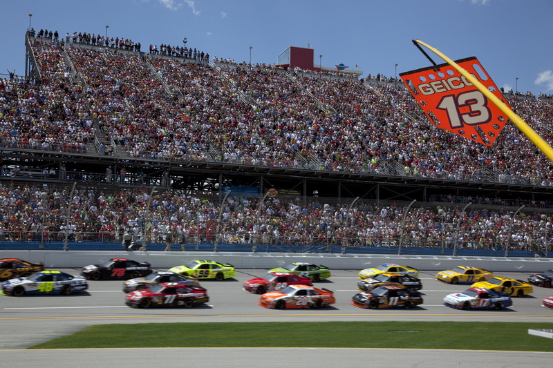 race, competition, motorsports, team, mode of transportation, motor vehicle, stadium, track, driver, large group of people, fast, day, spectator, architecture