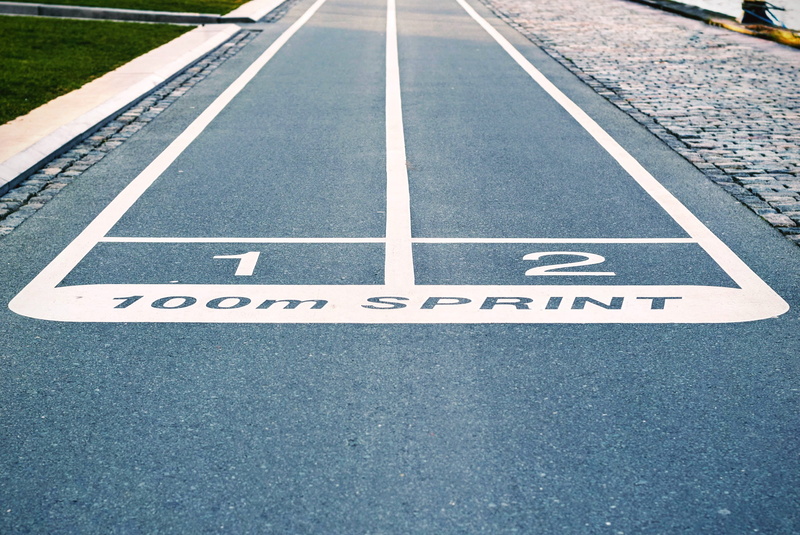 city, direction, sport, white color, paint, street, running track, marking, pavement, asphalt, blue, concrete, guidance, sign, road marking, symbol, western script