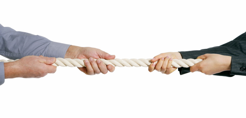 copy space, human hand, competition, males, body part, rivalry, teamwork, hand, tug, effort, white background, holding, two people, business, struggle