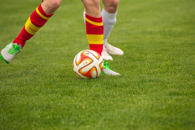 football boots, footballers, opponents, football player, soccer field, human leg, shin saver, soccer, fielder, athlete, motion, team sport, limb, soccer player