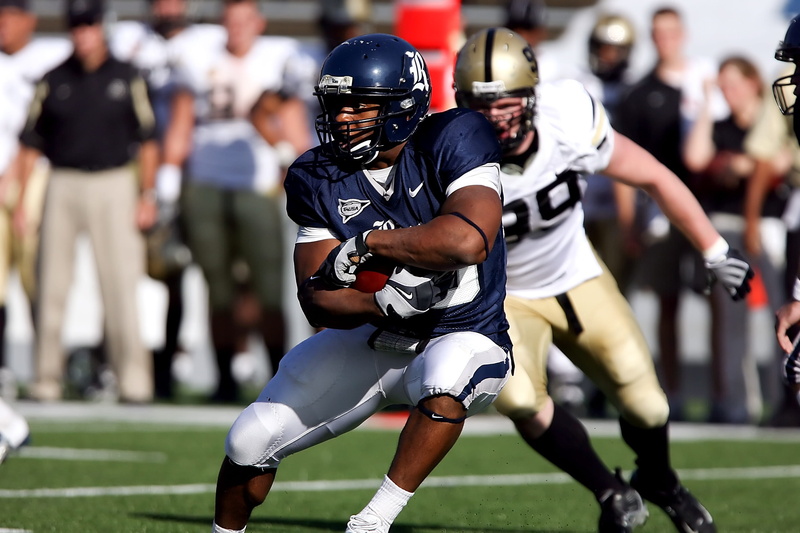 field, men, sports equipment, athletes, hugging, quarterback, cooperation, offense, players, teenager, ball, opponent, competitive sport, American football