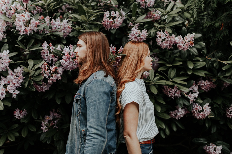 male, man with long hair, woman, directions, red head, flower head, positive emotion, denim, engagement, women, long hair, bonding, leisure activity, laying on eachother