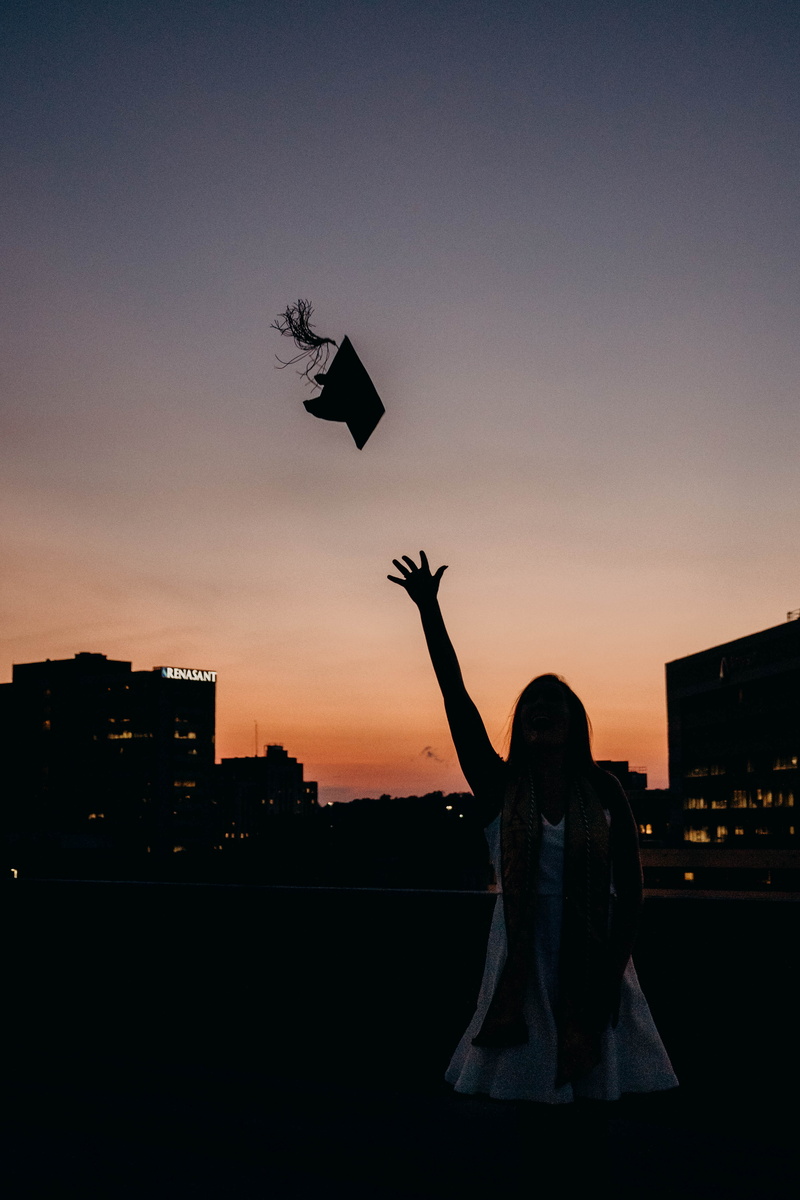 architecture, graduate, copy space, outdoors, arms raised, sunset, built structure, senior, grqduate, nature, silhouette, standing, one person, throwing