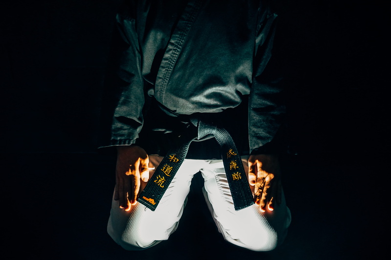 illuminated, closeup, asian, sport, martial arts, 5K, lifestyles, shoe, light - natural phenomenon, belt, studio shot, black belt, body part, jeans, judo