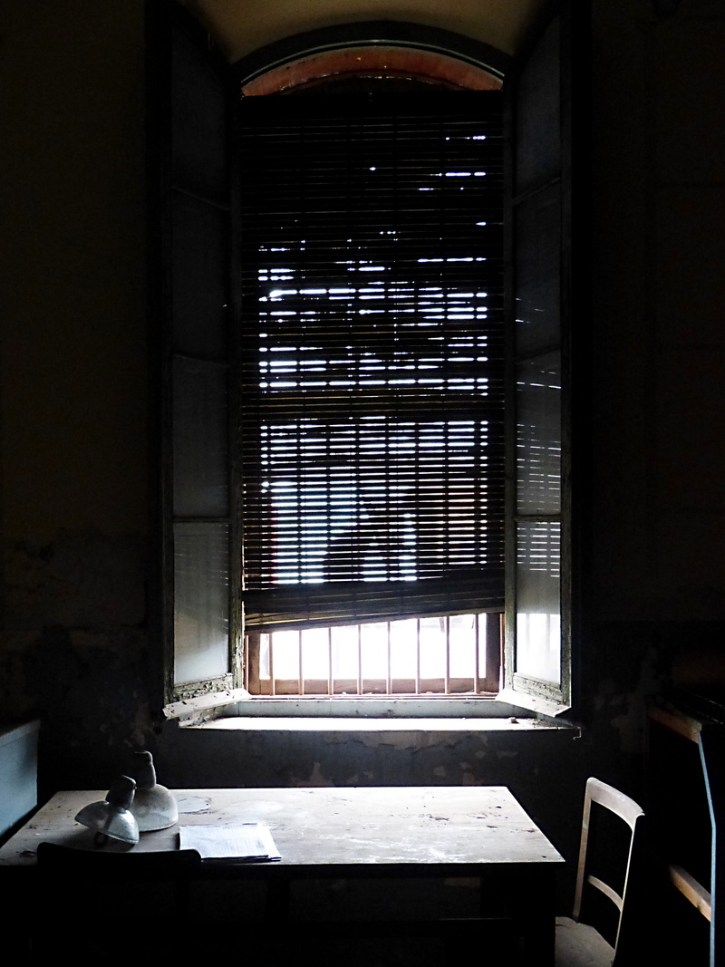 sunlight, nature, bars, metaphor, chair, furniture, wall - building feature, table, absence, desktop, wood - material, seat, pattern, architecture, indoors