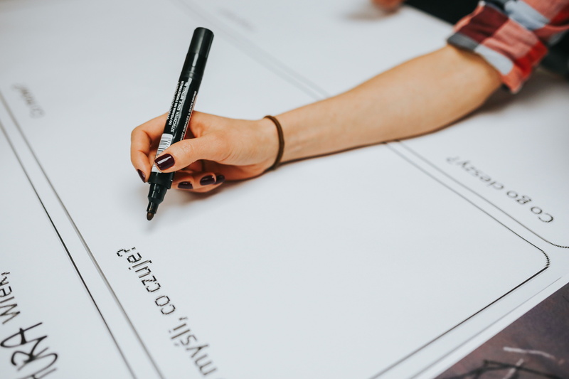creative, plan, one person, document, working, high angle view, paper, design, consumerism, human body part, session, pen, work, close-up, copy space, adult