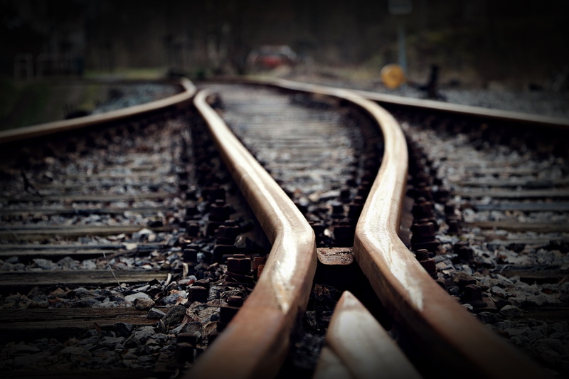 road intersection, direction, track, focus on foreground, metal, mystical, outdoors, focus, photo, junction, selective, brown, transportation, rail traffic