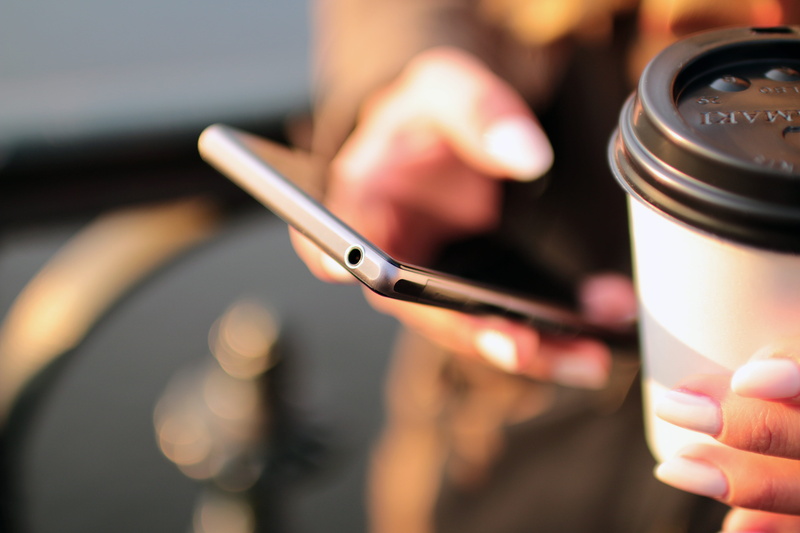 communication, texting, holding, touchscreen, lifestyles, technology, hands, hand, close-up, person, coffee, selective focus, smartphone, finger, focus on foreground
