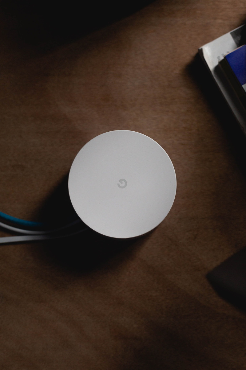 wifi, geometric shape, coffee table, technofile, router, logo, paper, still life, topdown, connection, 2K, indoors, close-up, table, two objects, white