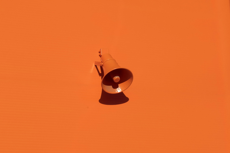 musical instrument, sunset, indoors, orange wall, speaker, hanging, red, backgrounds, arts culture and entertainment, copy space, colored background, single object