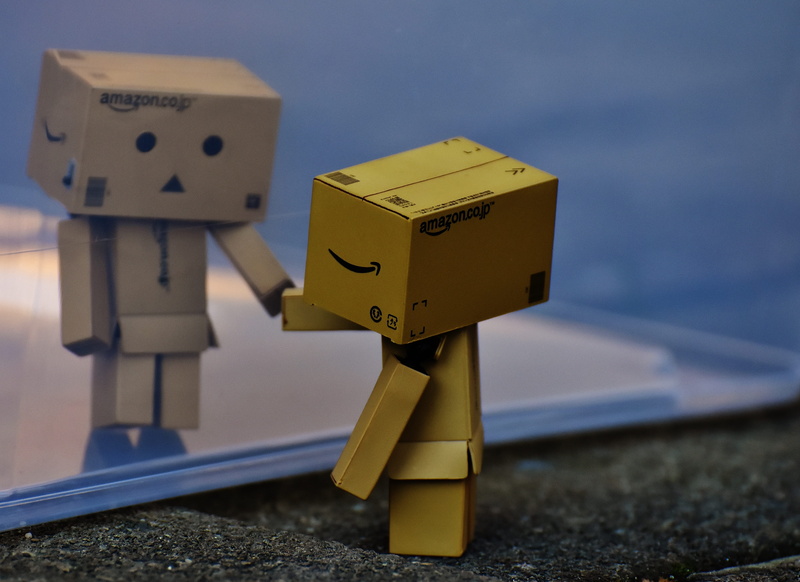 focus on foreground, built structure, cardboard, architecture, yellow, day, no people, danbo, art and craft, sad, communication, children, figurine, robot