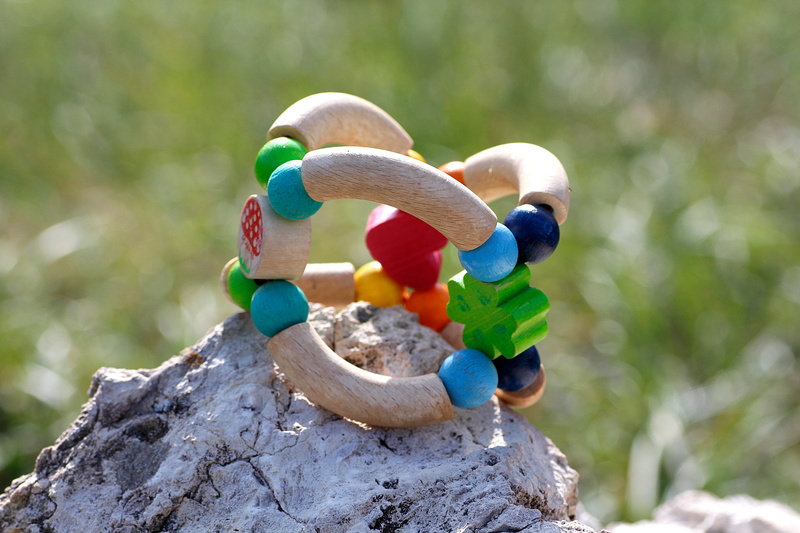 focus on foreground, stone - object, no people, multi colored, close-up, plant, outdoors, rock - object, stone, day, wood, solid, metal, baby toy, rock