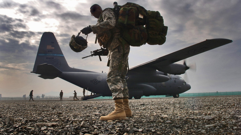 incidental people, camouflage, 2K, army, cloud - sky, airplane, propeller, suit, air vehicle, outdoors, soldier, military, land, mode of transportation