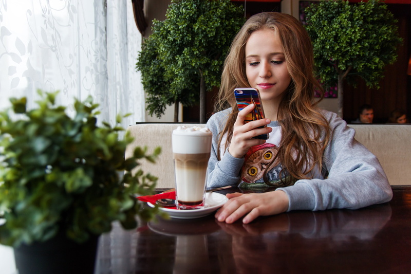 teen, one woman only, only women, gray, coffee, smile, one person, cream, hairstyle, flowers, hair, pleased, table, long hair, food and drink, coffee cup
