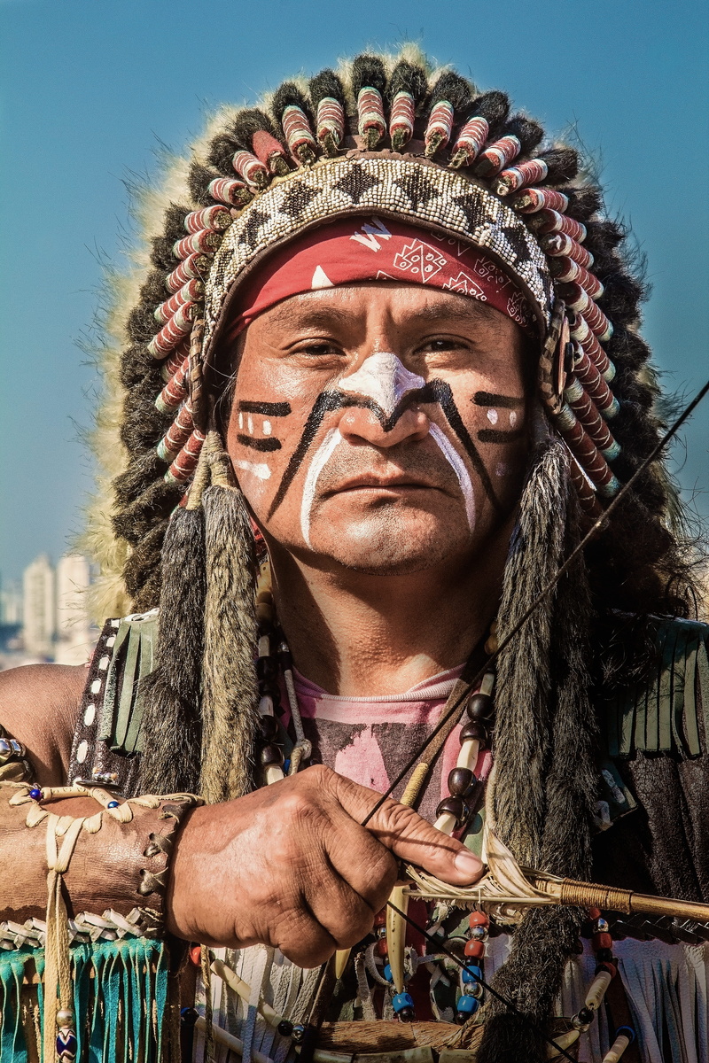 bow, warm clothing, mid adult, real people, holding, adult, 5K, men, close-up, looking at camera, clear sky, indian dress, nature, weapon, face, male