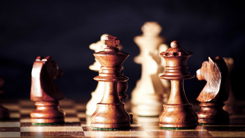 indoors, arts culture and entertainment, quality, black background, pawn - chess piece, focus on foreground, game, queen - chess piece, wooden, leisure games