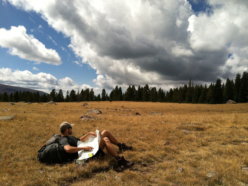 people, wear, forest, leisure activity, grass, grassland, map, backpacking, man, women, adult, two people, black, couple - relationship, rocks, clouds