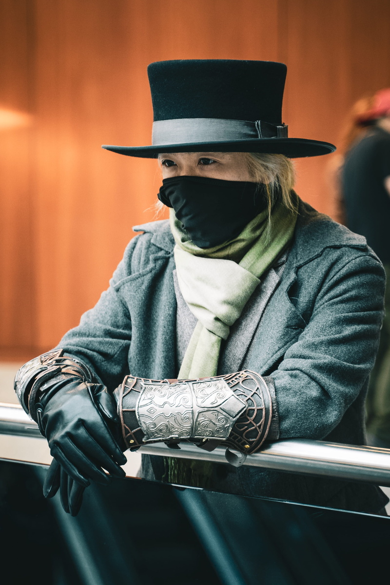 person, waist up, lifestyles, front view, balaclava, apparel, holding, arm, sun hat, seat, helmet, finger, clothing, one person, real people, adult, man
