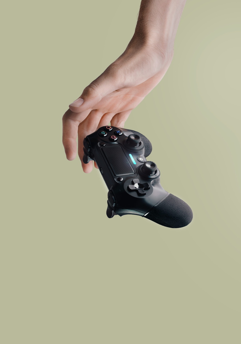 dualshock, technology, single object, camera - photographic equipment, hand, wireless, unrecognizable person, human finger, controller, one person, studio shot