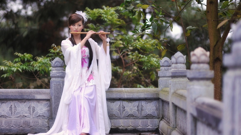 real people, white dress, tree, trees, musician, beauty, flute, outdoors, young women, playing, long hair, portrait, brunette, hairstyle, beautiful woman