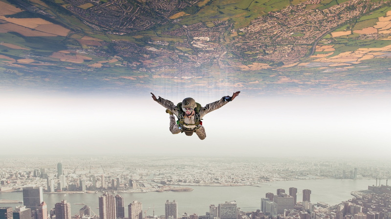 human arm, human limb, outdoors, paratroopers, full length, nature, s, 2K, brown, built structure, mid-air, flying, office building exterior, city, aerial view