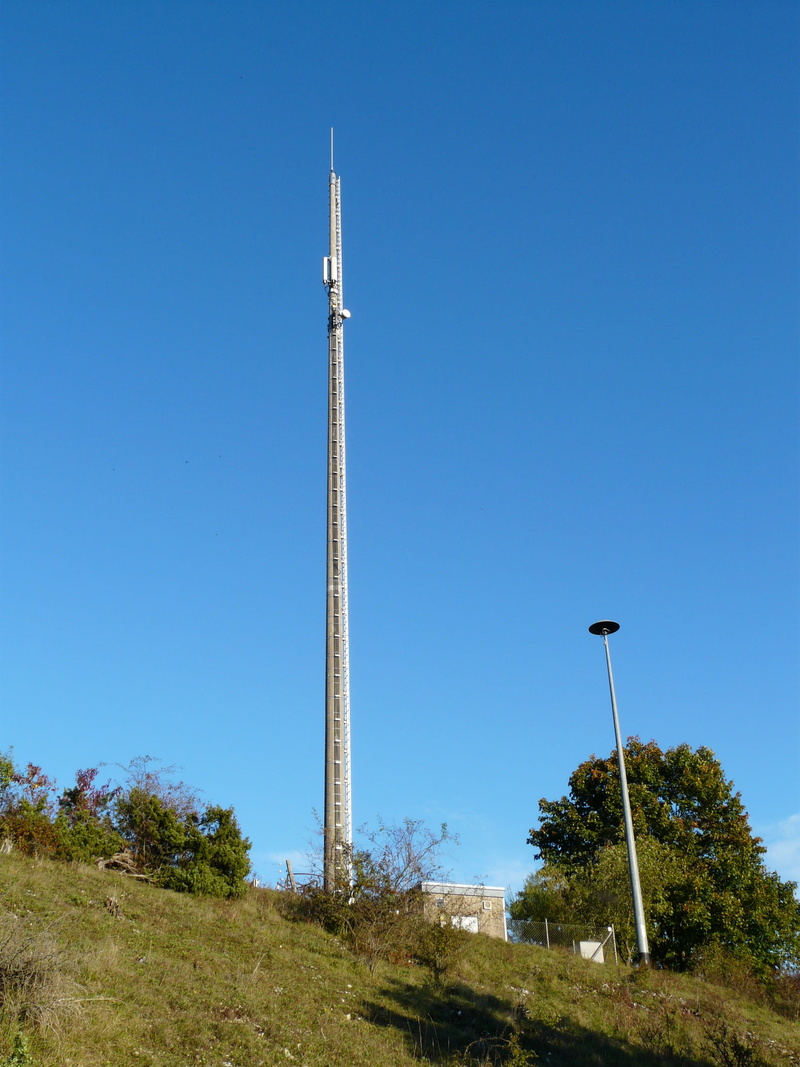 low angle view, reinforced concrete, plant, siren, radio, sky, tower, day, grass, telecommunications, radio antenna, communication, blue, mechanical siren