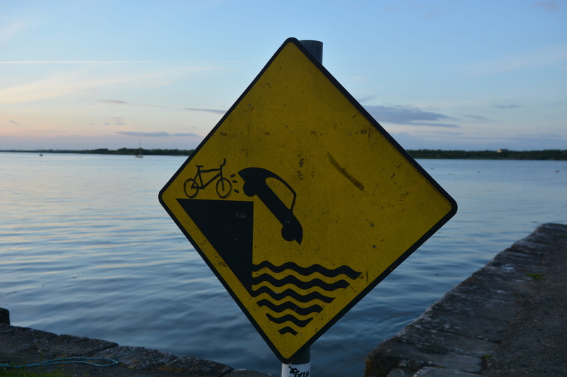 nature, day, information, signage, sea, black, focus on foreground, water, road, sky, outdoors, representation, no people, warning sign, shape, Technology