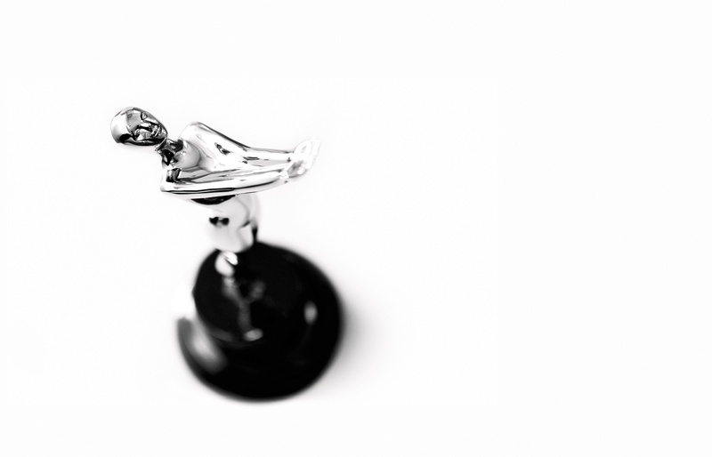 white background, jewelry, indoors, black, navigation, glass, trophy, interface, people, diamond - gemstone, process, arrow, single object, pendant, still life