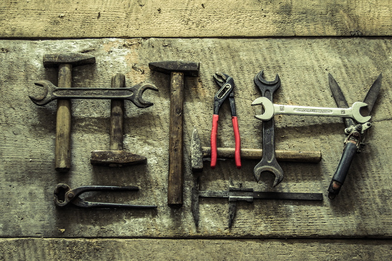 security, wall - building feature, equipment, metal, indoors, wrench, brown, no people, variation, tools, close-up, hanging, tool, hammer, vintage, choice